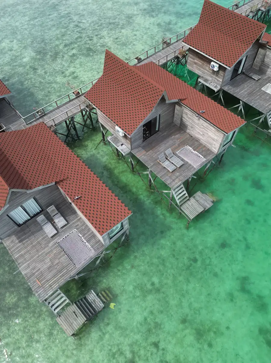 Aerial drone shot of the overwater Sea Coral Resort