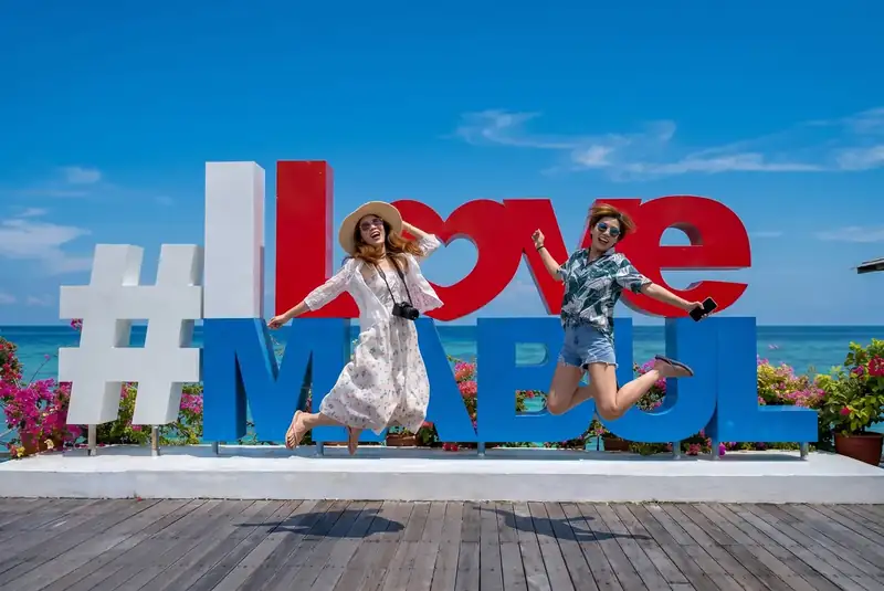Famous photo spot at the I Love Mabul sign on Mabul Island Sea Coral Resort