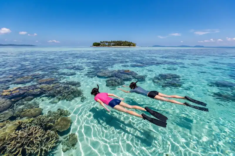 Snorkeling in the vibrant coral reefs of Tun Sakaran Sea Coral Resort